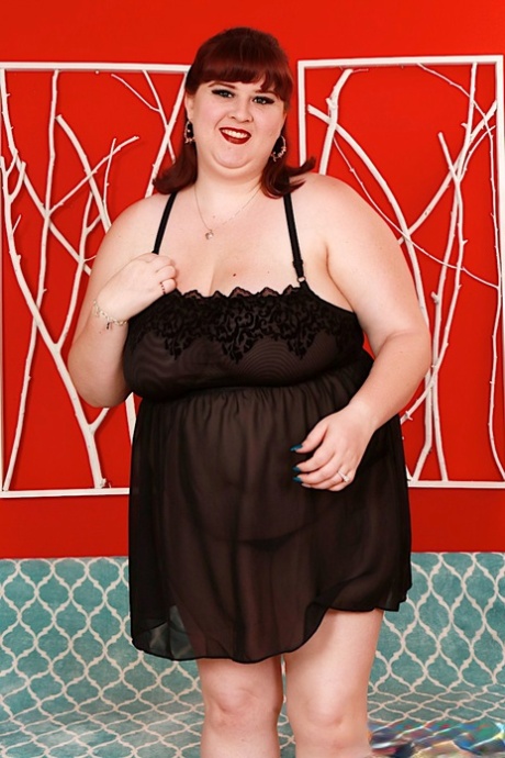 SSBBW Shanelle Savage removes baby doll lingerie to pose naked on a futon 77598601