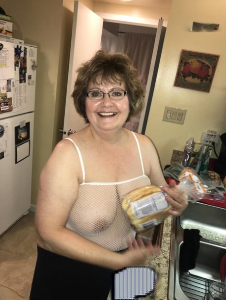 Mature lady Busty Bliss has sex on a bed with her toy boy 60902212