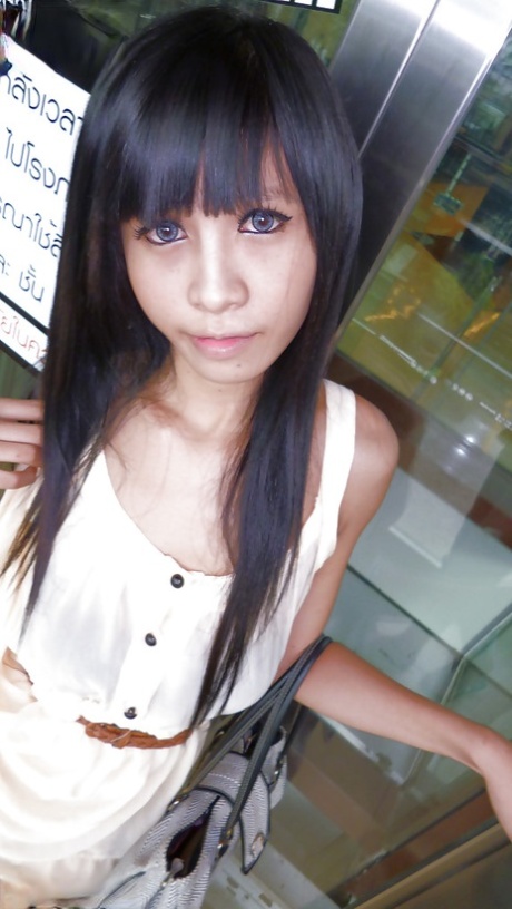 Cute Asian tranny Noot eating cotton candy and posing in high heels 78351204